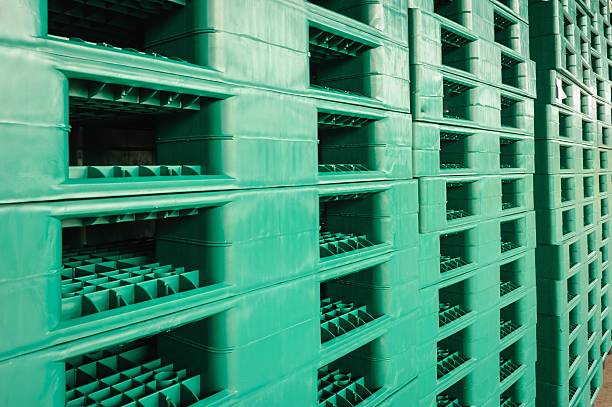 green plastic pallets in warehouses, sorted and delivered.